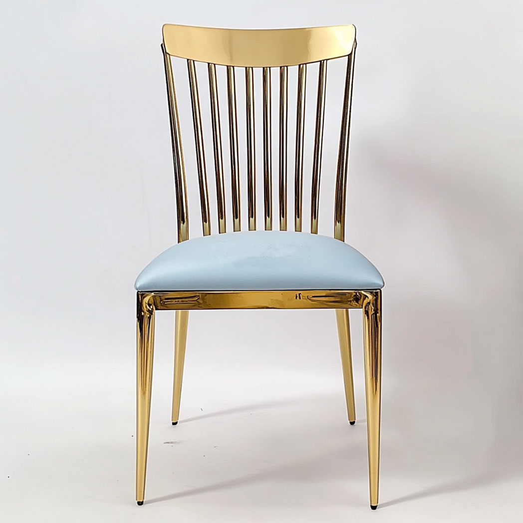 Elegant event setup featuring gold stainless steel wedding chairs with vertical stripes backrests