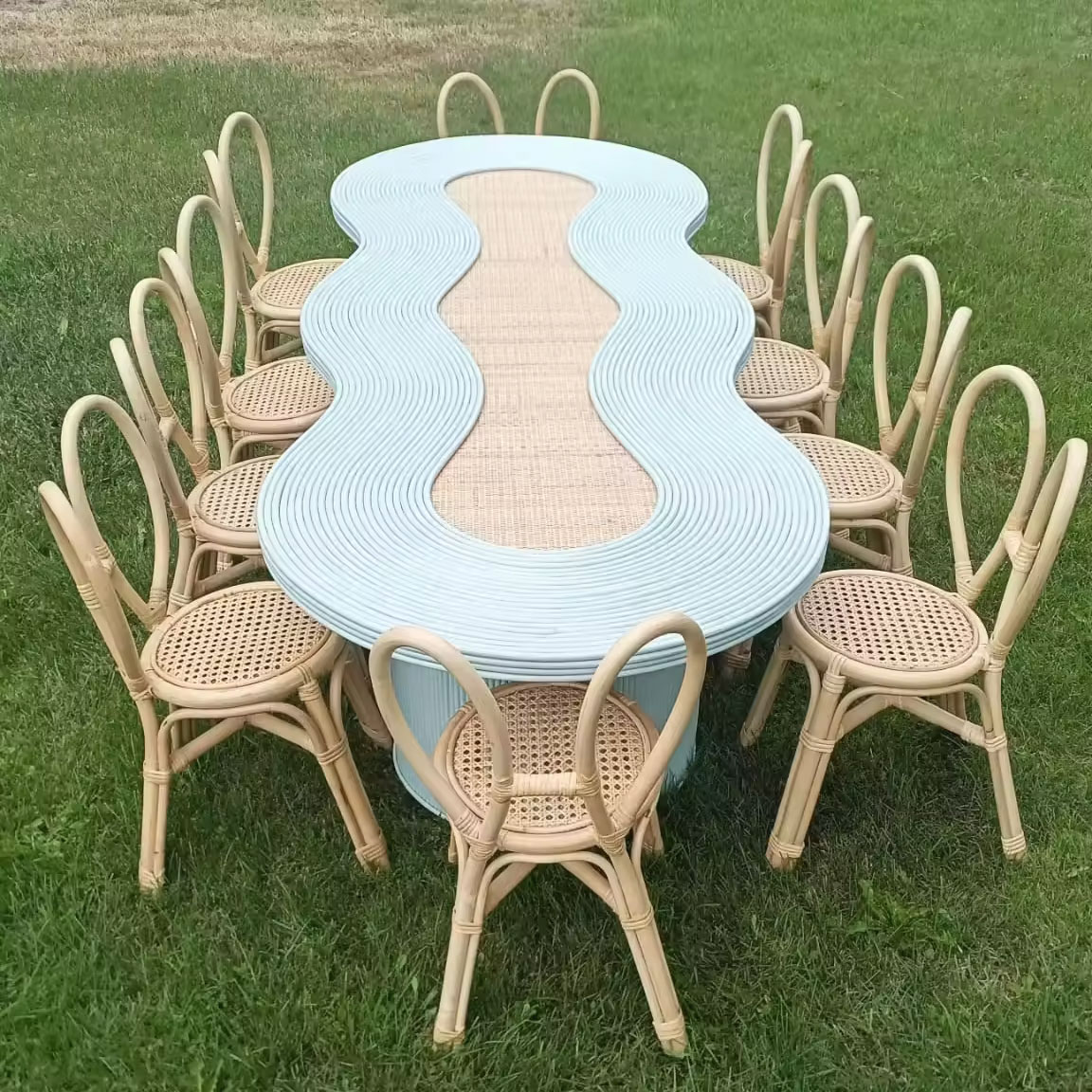 Children’s outdoor party with long wavy pastel blue rattan table