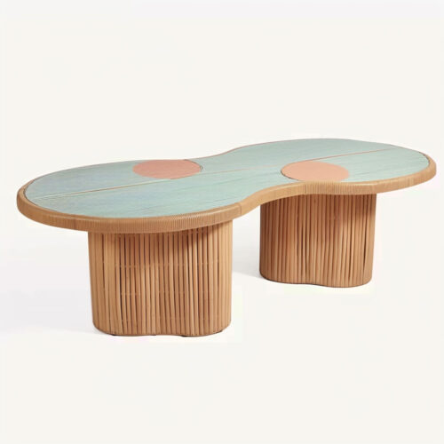 Pastel blue long rattan dining table with wavy edge and white line detail, set outdoors for kids party