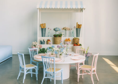 Pastel Macaron Kids Rattan Chairs in Blue and Pink Around Round Table with Flower Cart
