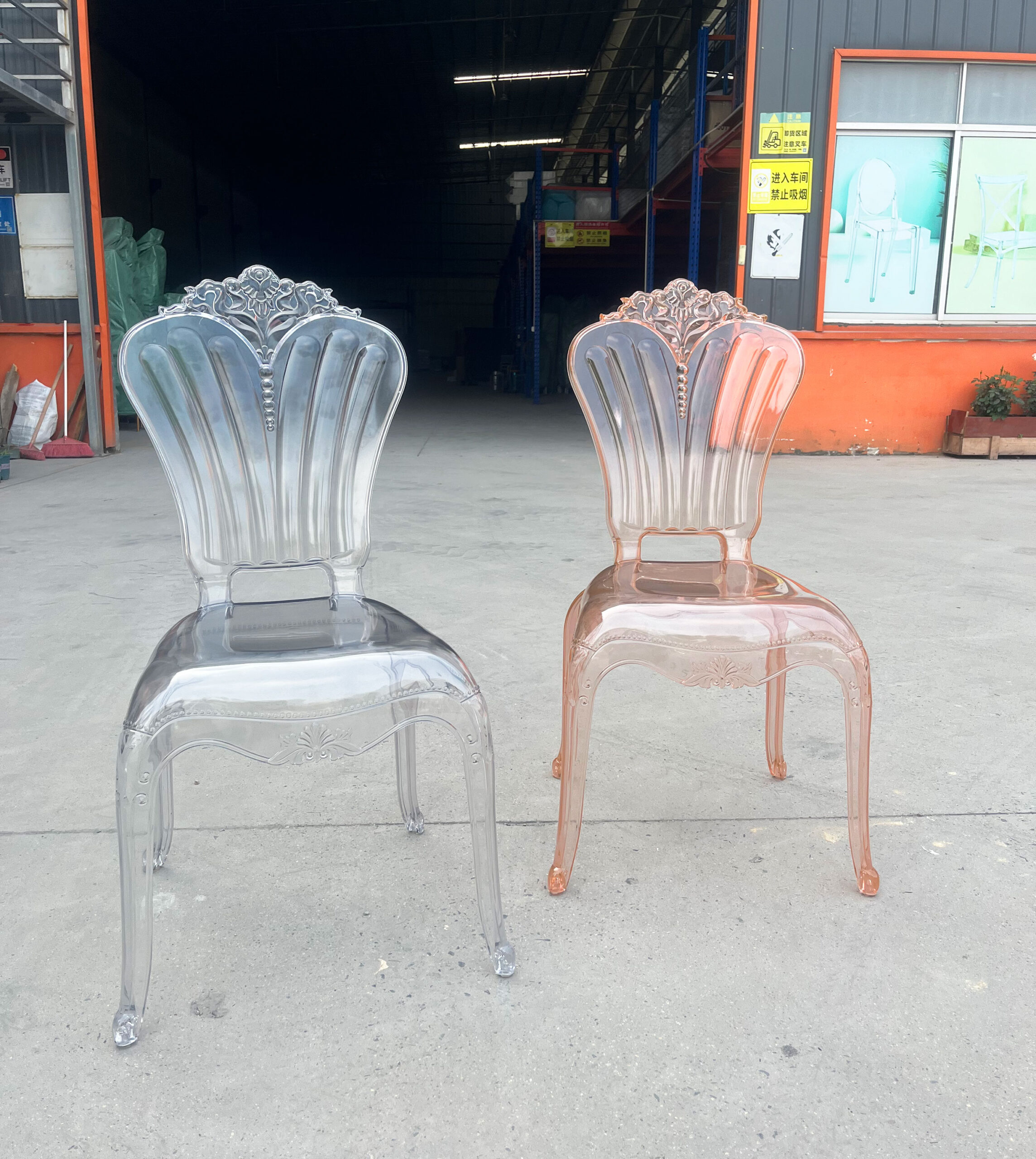 Side-by-side view of transparent and amber acrylic Baroque banquet chairs with floral backrests
