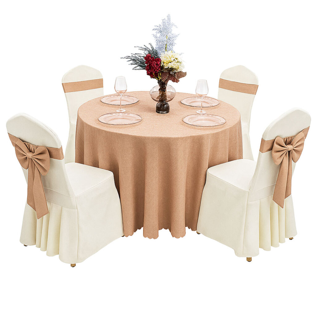 Elegant banquet setup with ivory skirted chair covers and brown sashes, around a round table with a brown tablecloth and floral centerpiece