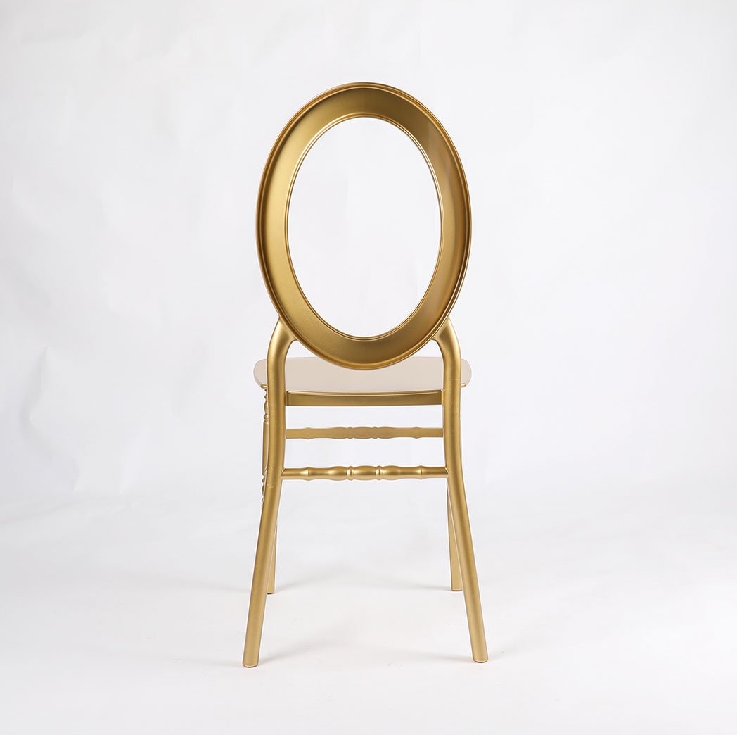Back view of luxury gold oval back resin banquet chair with hollow ring design, lightweight and stackable for weddings and banquets