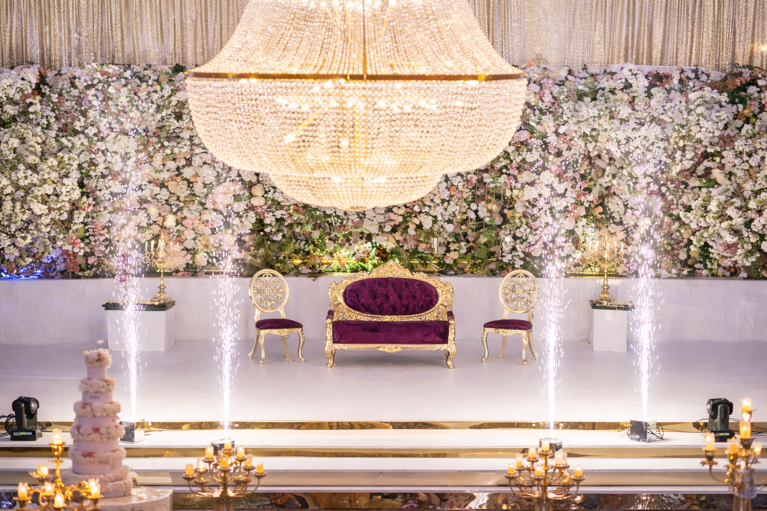 Luxury London wedding stage with crystal chandelier and floral backdrop