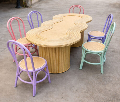 Wavy kids party table with natural rattan top for birthday event and wedding kids zone setup