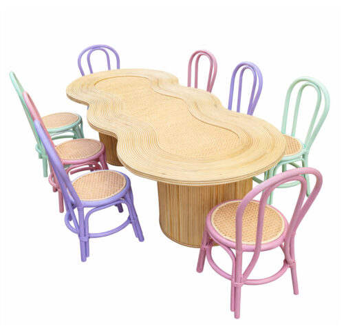 Wavy kids rattan party table with pastel bentwood chairs for children's birthday party and wedding event setup