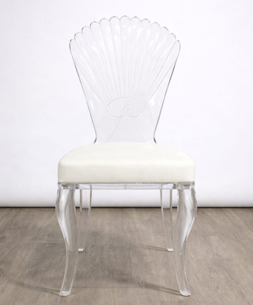 Solid acrylic shell back wedding chair with clear curved legs and padded seat for luxury event and banquet seating