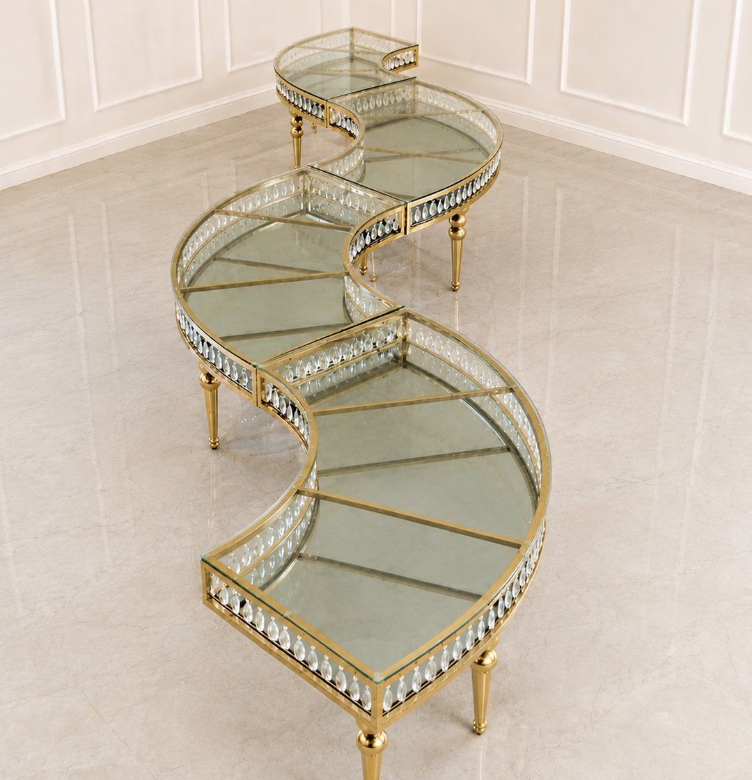 CrystalWave modular glass wedding table with gold stainless steel frame and crystal edge details in luxury serpentine event setup.