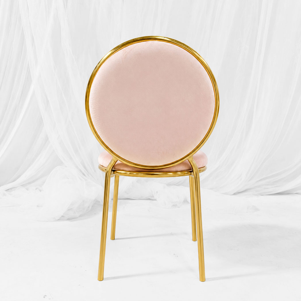 Back view of kids round back chair with pink velvet upholstery and mirror gold stainless steel frame
