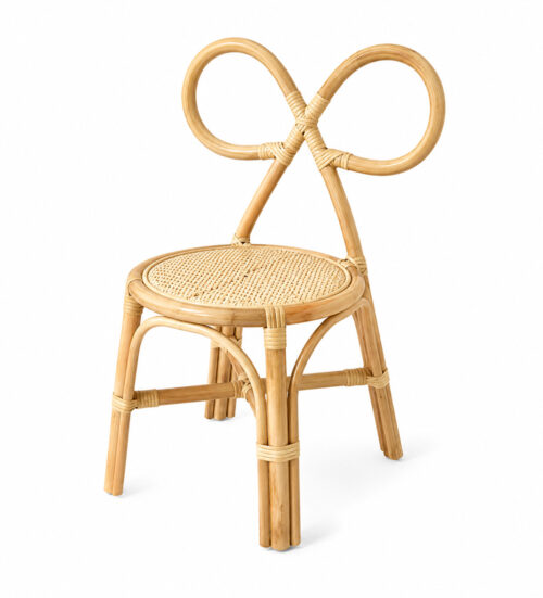Natural bow-back rattan chair for kids featuring a handwoven cane seat and decorative bow-shaped backrest.