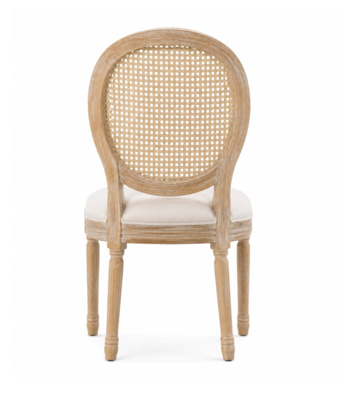 Back view of a rustic oak Louis XVI cane back chair with woven rattan oval backrest and upholstered seat for weddings, banquets, and hospitality venues.