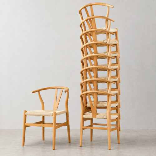 Stackable Scandinavian Y-Back chairs with woven cord seats for wedding rentals, event venues and hospitality projects