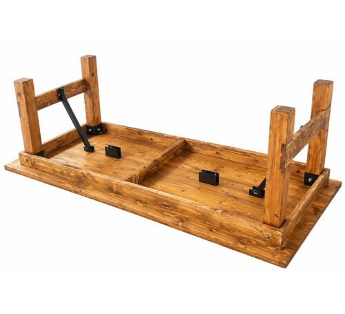 Underside view of rustic wooden kids farm table showing raised folding trestle legs, wooden support frame and black metal locking braces